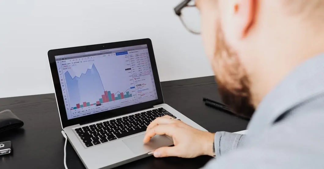 Man signing document with pen while woman holds clipboard, representing agreement issues with Amazon PPC ads not showing.