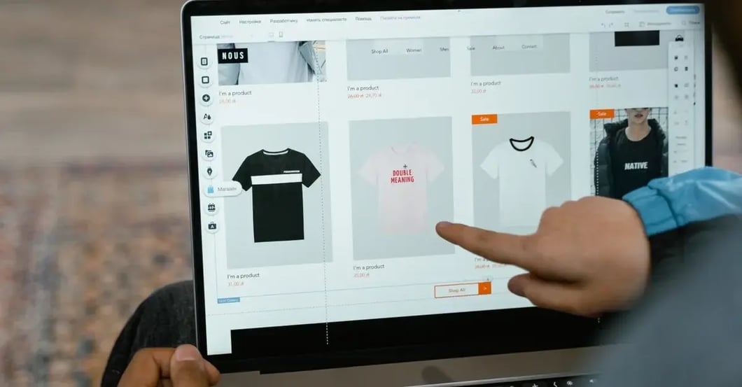 Person pointing at laptop screen displaying grid of t-shirt product listings with Amazon image requirements guidelines.